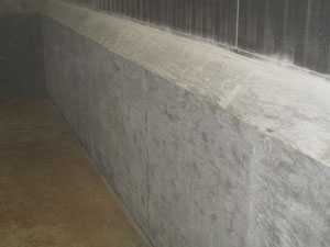 industrial concrete spill containment berm curb before